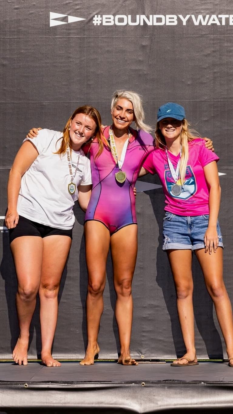 Three women on a podium